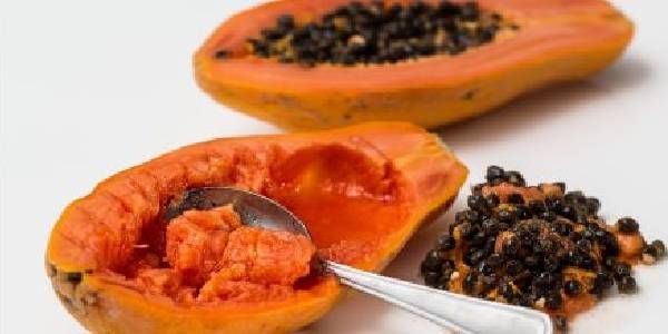 eating papaya fruit